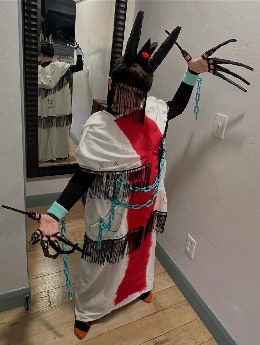 Handmade Halloween costume with a hooded robe and long claw hands